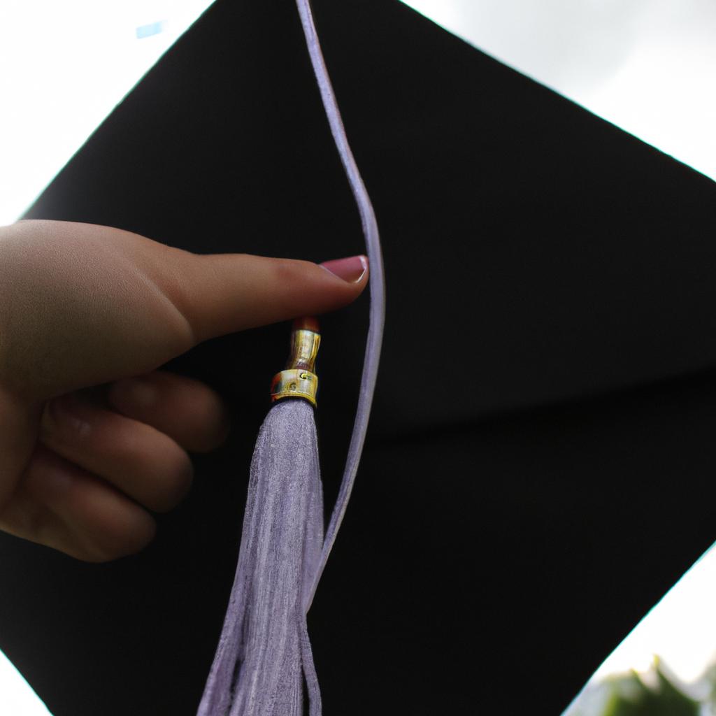 Person holding a graduation cap