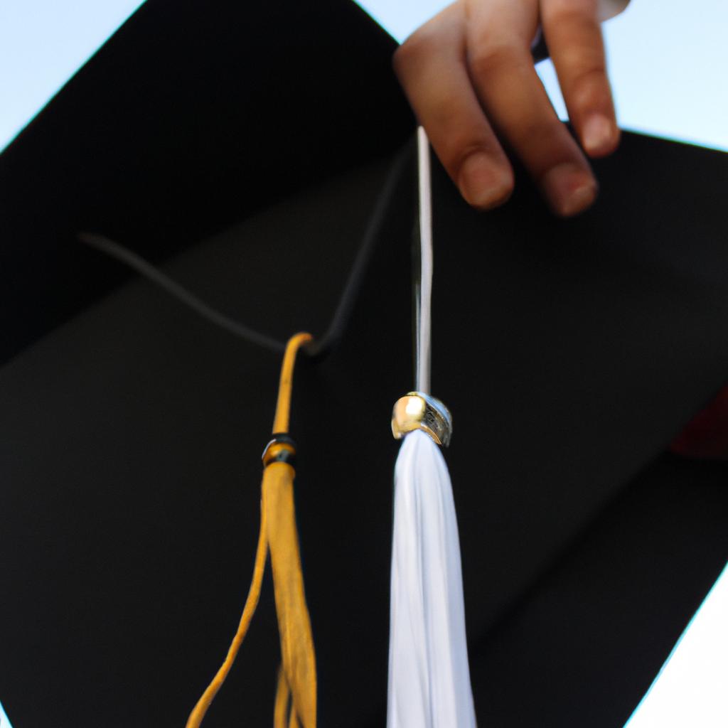 Person holding a graduation cap